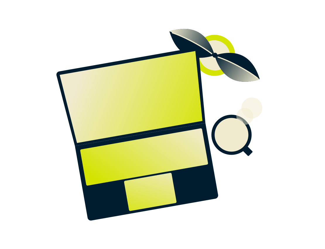 Portátil com uma planta e bebida.